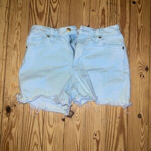 The jeans shorts are a mixture of blue and white so it’s like a light blue.